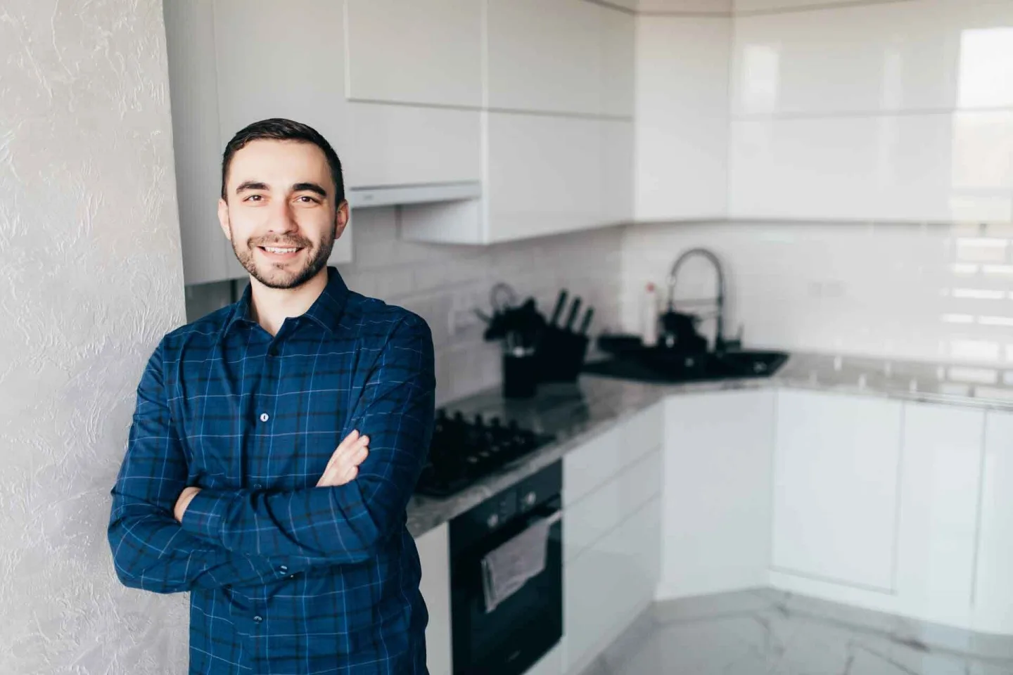 A Quick Keys Home Buyer team member in a renovated kitchen